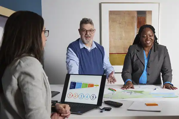 Three employees working together