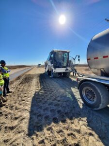 construction workers monitor progress of RM 652 pavement rehabilitation for TXDOT El Paso District