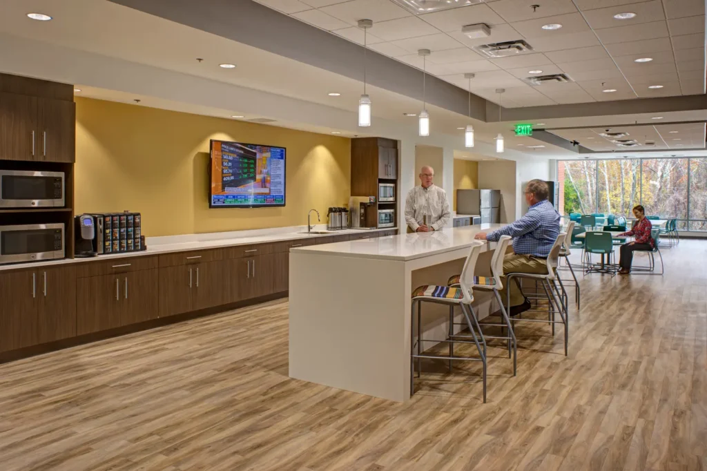 People interacting in a common area at JMT