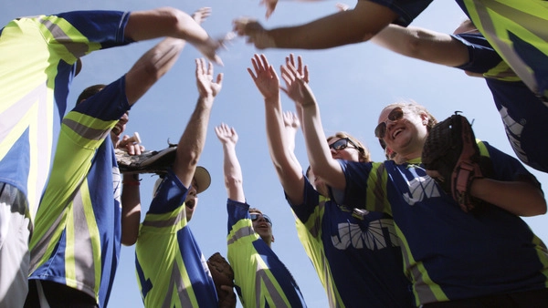 JMT Softball team high-fiving