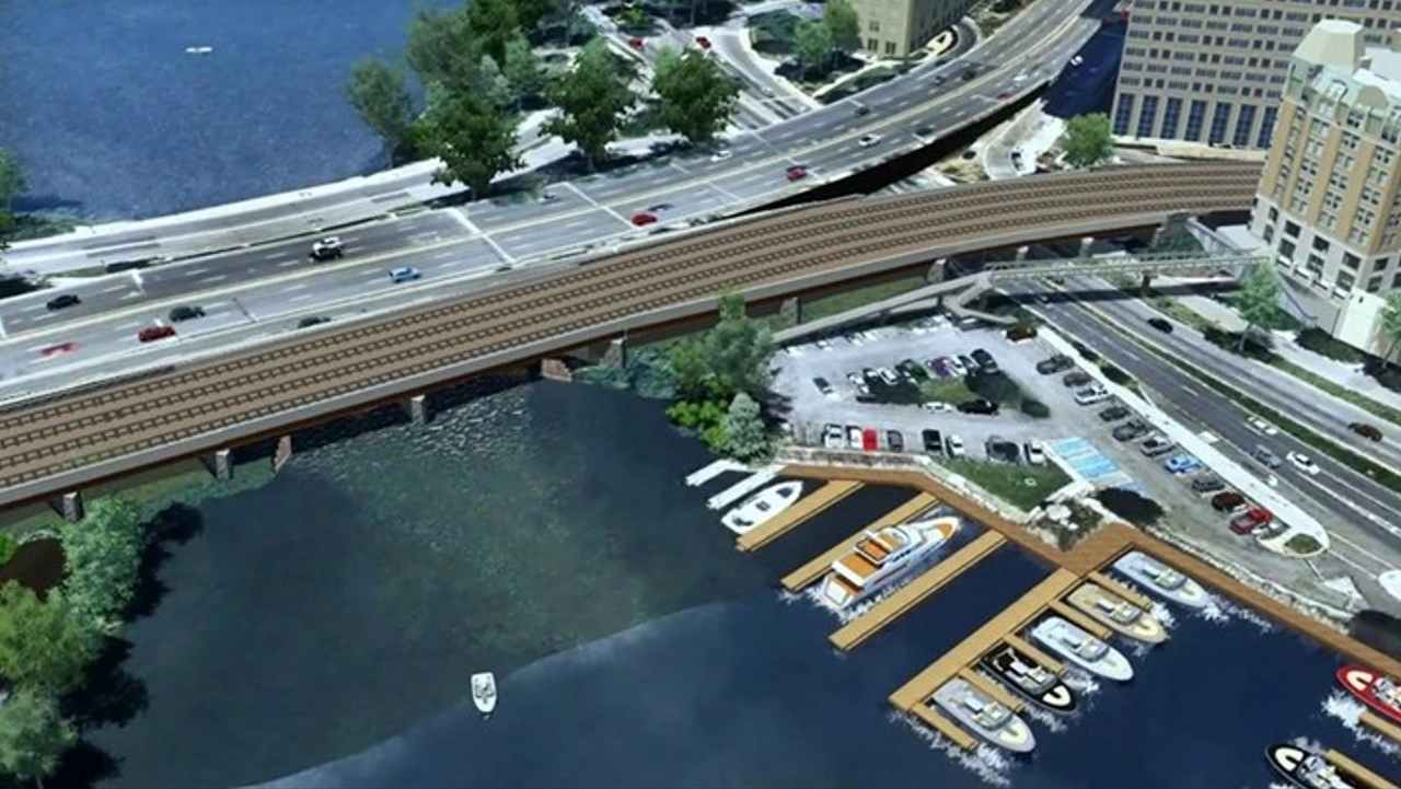 Large overpass, boats docked in water