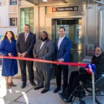 Group of professionals at a ribbon cutting