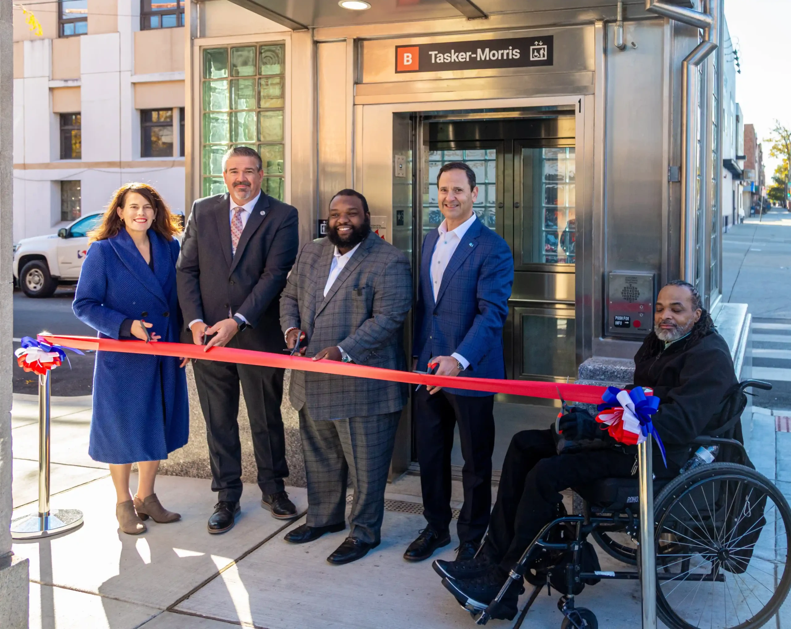 Group of professionals at a ribbon cutting